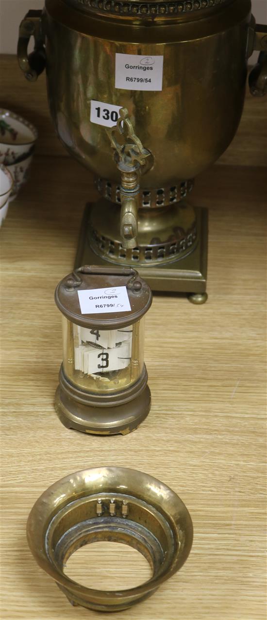 A brass samovar and a brass Flick clock